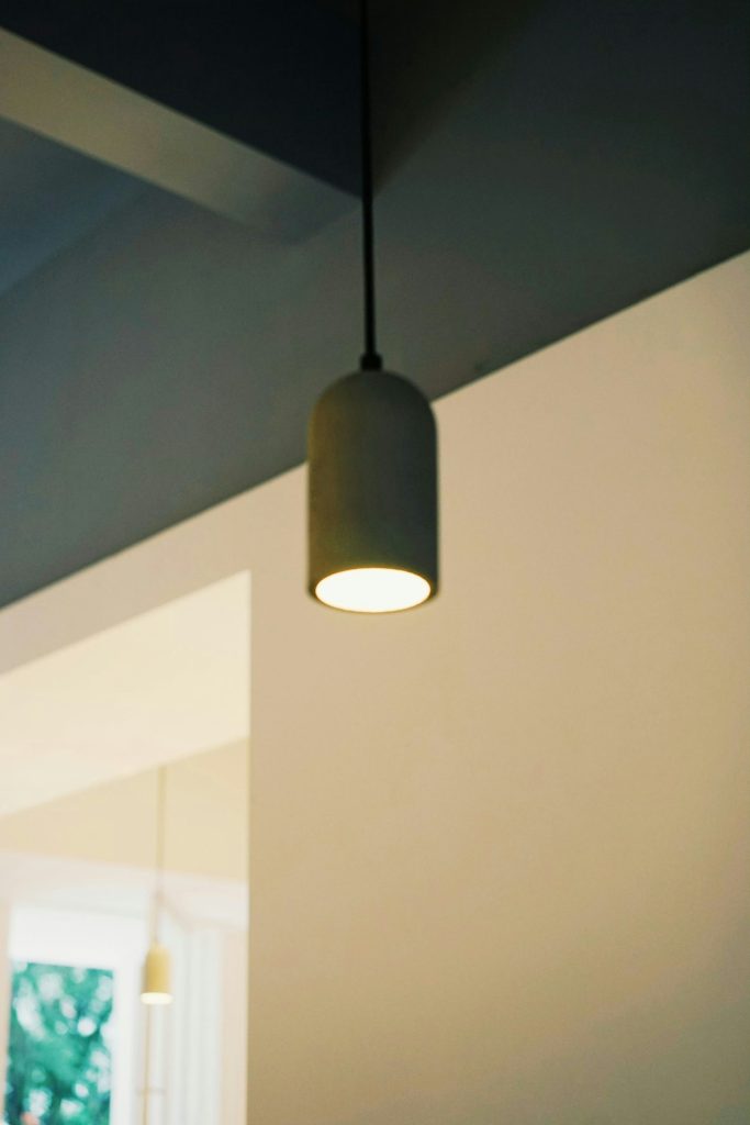 A modern pendant light hangs from the ceiling.