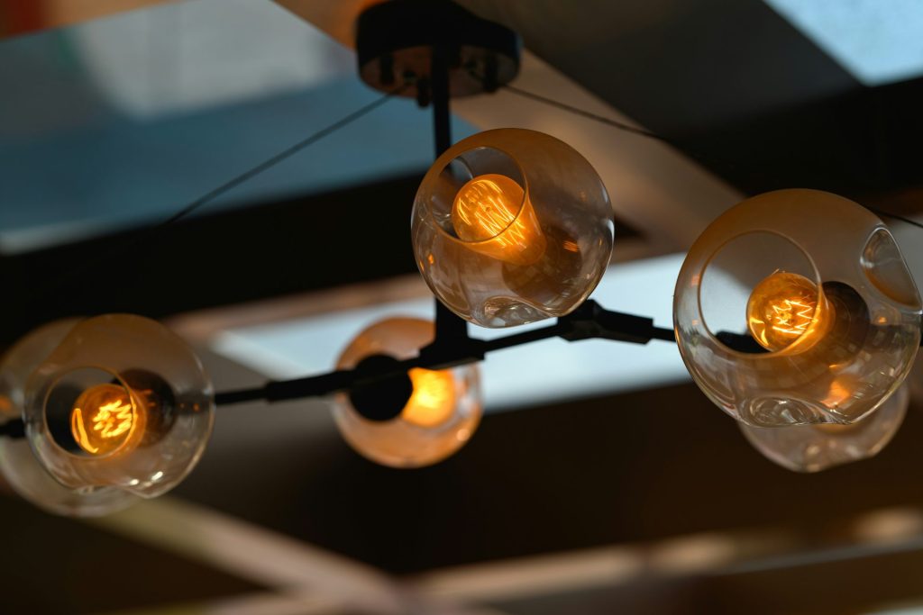 A bunch of lights hanging from a ceiling